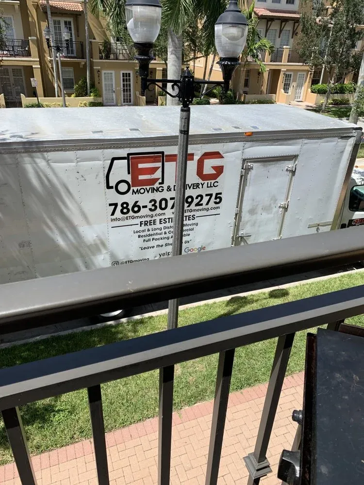 ETG Moving & Delivery truck with phone number on the side